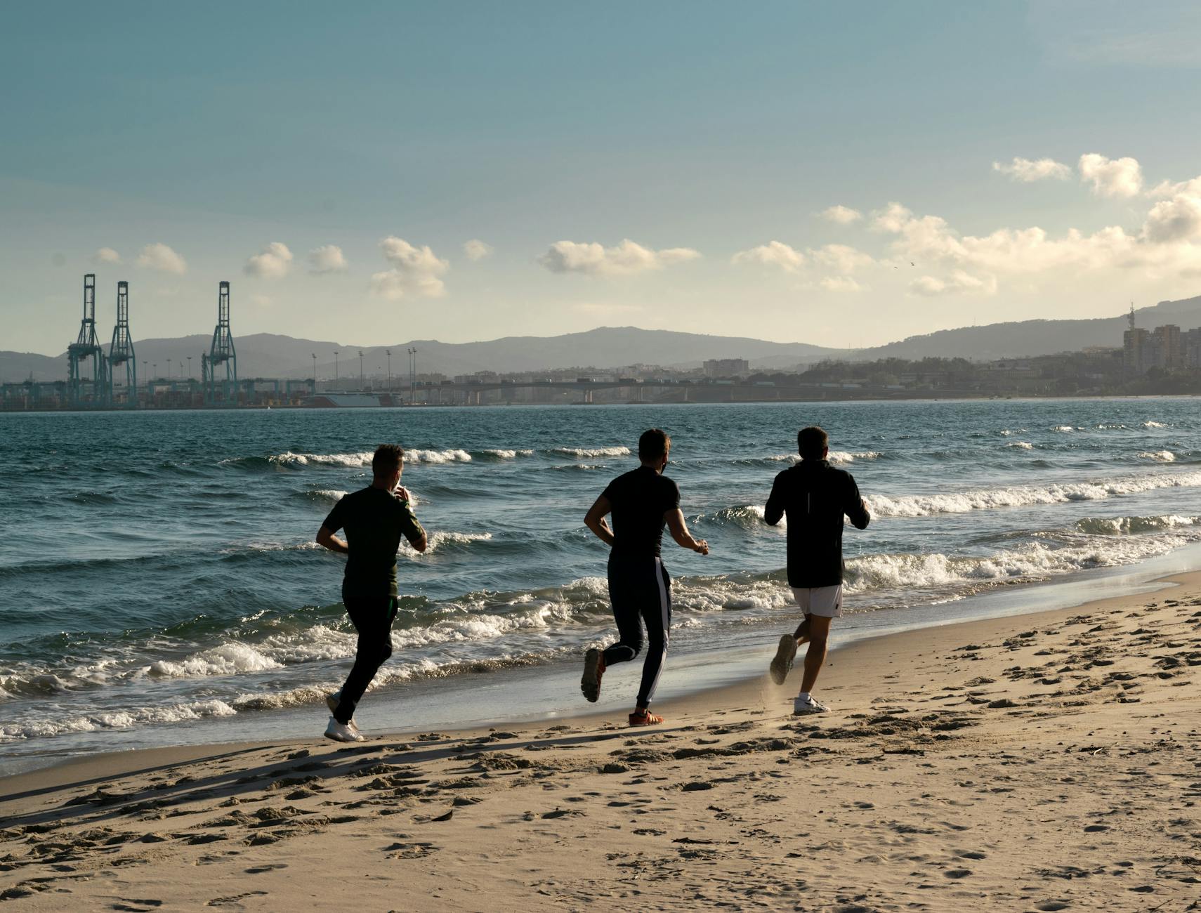 men running at the beach