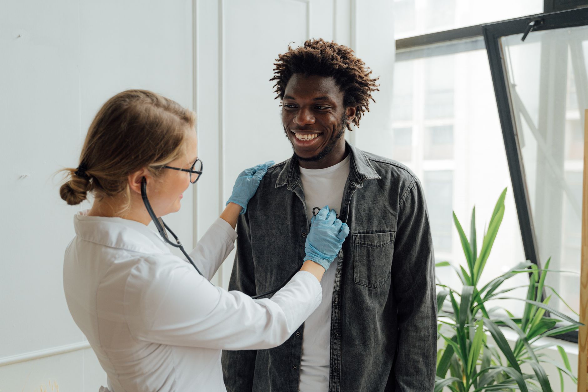 doctor checking the heart beat of a man